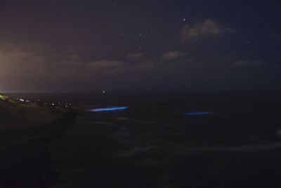 Scenic view of sea against sky at night