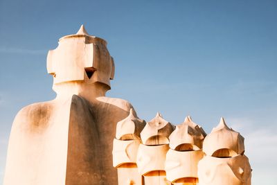 Low angle view of statue against sky