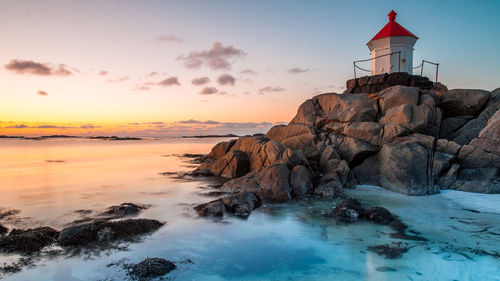 Scenic view of sea against sky at sunset