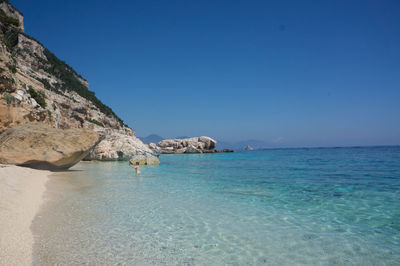 Scenic view of sea against clear blue sky