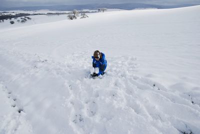 Full length of child on snow on land
