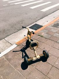 High angle view of tricycle on footpath