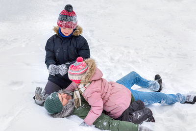 Rear view of woman skiing on snow
