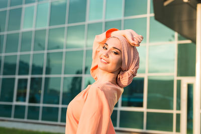 Portrait of a young woman looking away