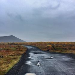 Surface level of empty road along countryside landscape