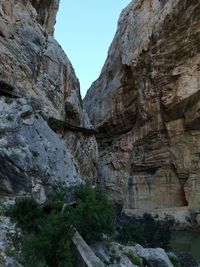 Low angle view of rock formation against sky