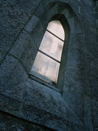 Low angle view of window on wall