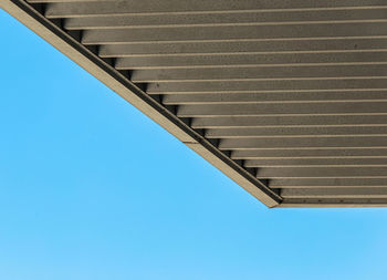 Low angle view of building against clear blue sky