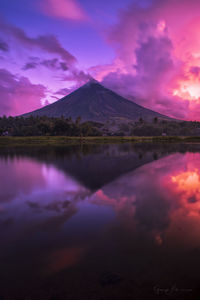 Scenic view of lake against sky during sunset