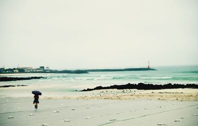 Woman standing on beach