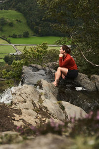 Man sitting on rock