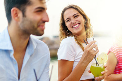 Smiling young couple with ice cream
