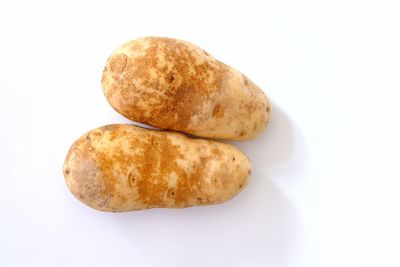 High angle view of bread against white background