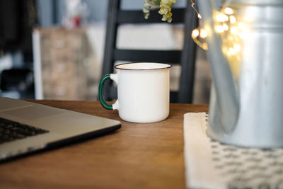 Close-up of coffee cup on table