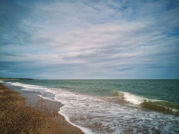 Scenic view of beach against sky