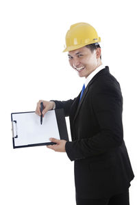 Man holding camera while standing against white background