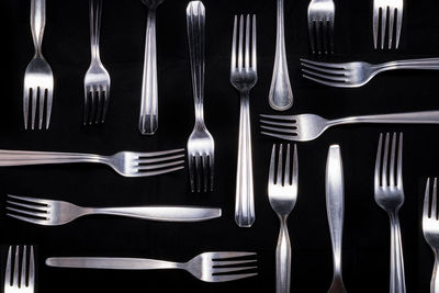 High angle view of forks on black background