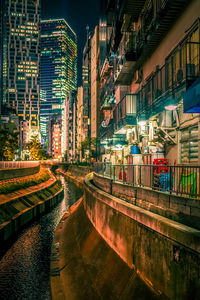 Illuminated buildings in city at night