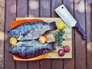 Close-up of fishes on cutting board