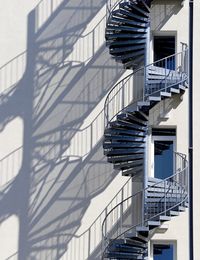 Low angle view of spiral staircase in building