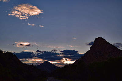 Scenic view of silhouette mountains against sky during sunset