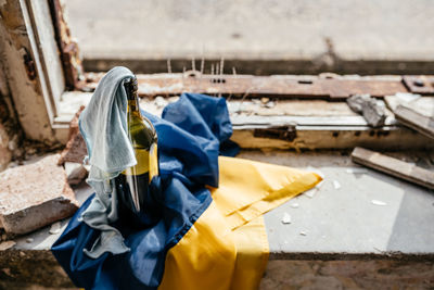 Low section of woman standing by wall