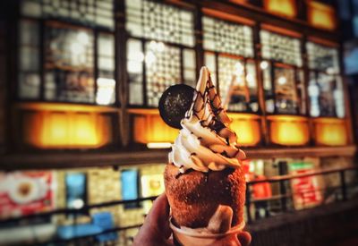 Woman holding ice cream cone