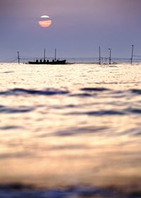 Scenic view of sea at sunset