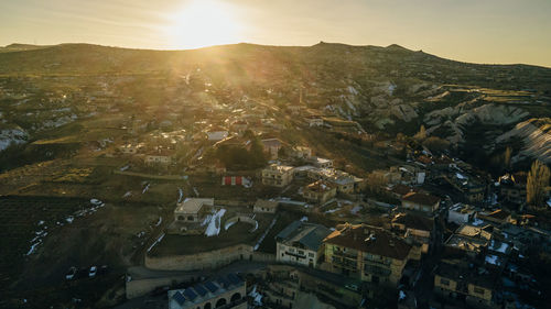 Aerial view of townscape against sky during sunset