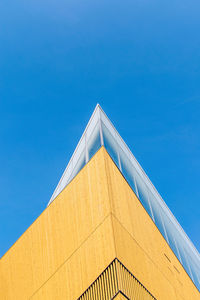 Low angle view of building against clear blue sky