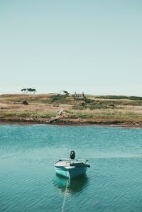 Boat in sea against clear sky