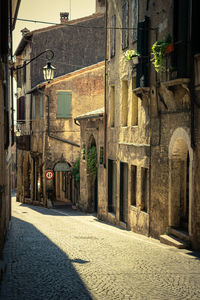 Narrow alley amidst buildings in city