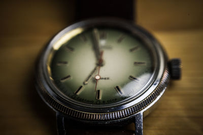 Close-up of clock on table