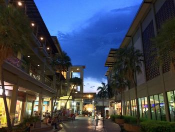 People in illuminated city at night