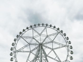 Low angle view of ferris wheel against sky