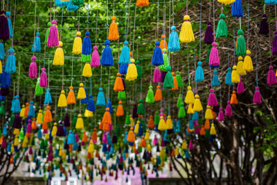 Multi colored umbrellas hanging in row