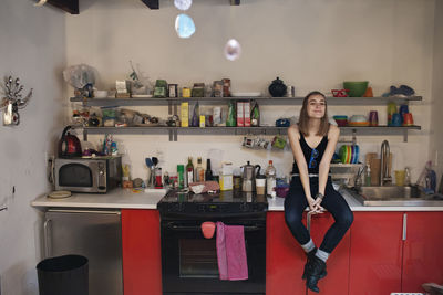Portrait of woman standing at home