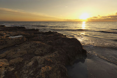 Scenic view of beach during sunset