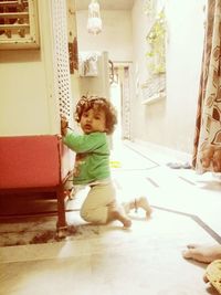 Full length of cute baby girl at home