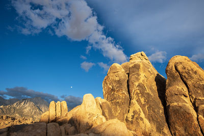 Low angle view of rocks against sky