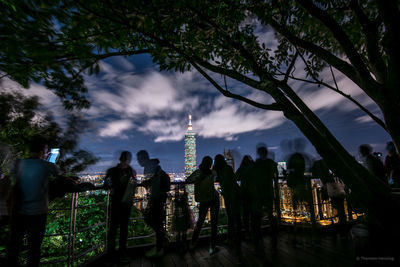 Panoramic view of city against cloudy sky