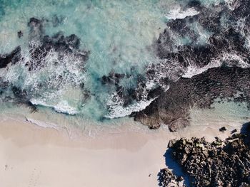 High angle view of rocks in sea