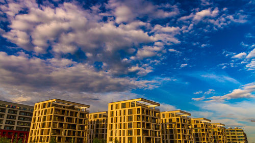 Low angle view of building against cloudy sky