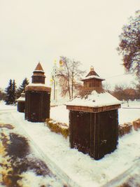 Built structure on snow field against clear sky