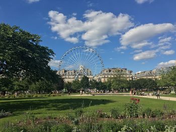 Ferris wheel in park against sky