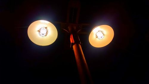 Low angle view of illuminated light bulb