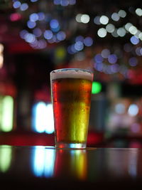 Close-up of beer glass on table