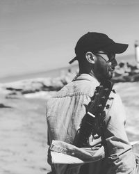 Full length of man wearing sunglasses standing on beach