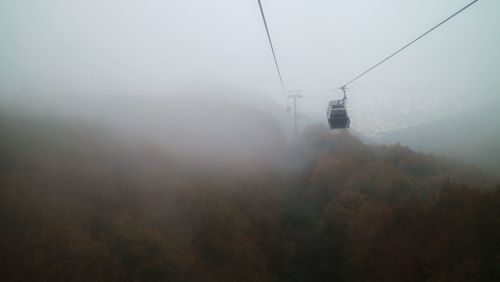 View of overhead cable car against sky