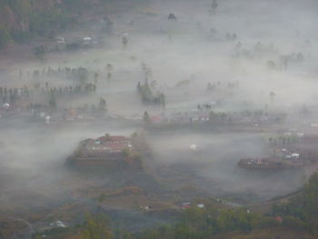 High angle view of cars on landscape against sky